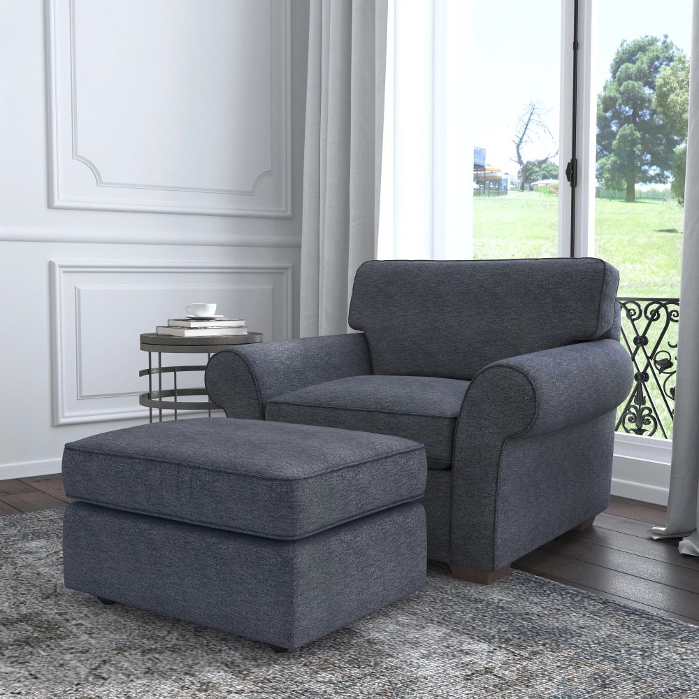 Flexsteel Vail chair and ottoman in living room with wood floors and white walls.