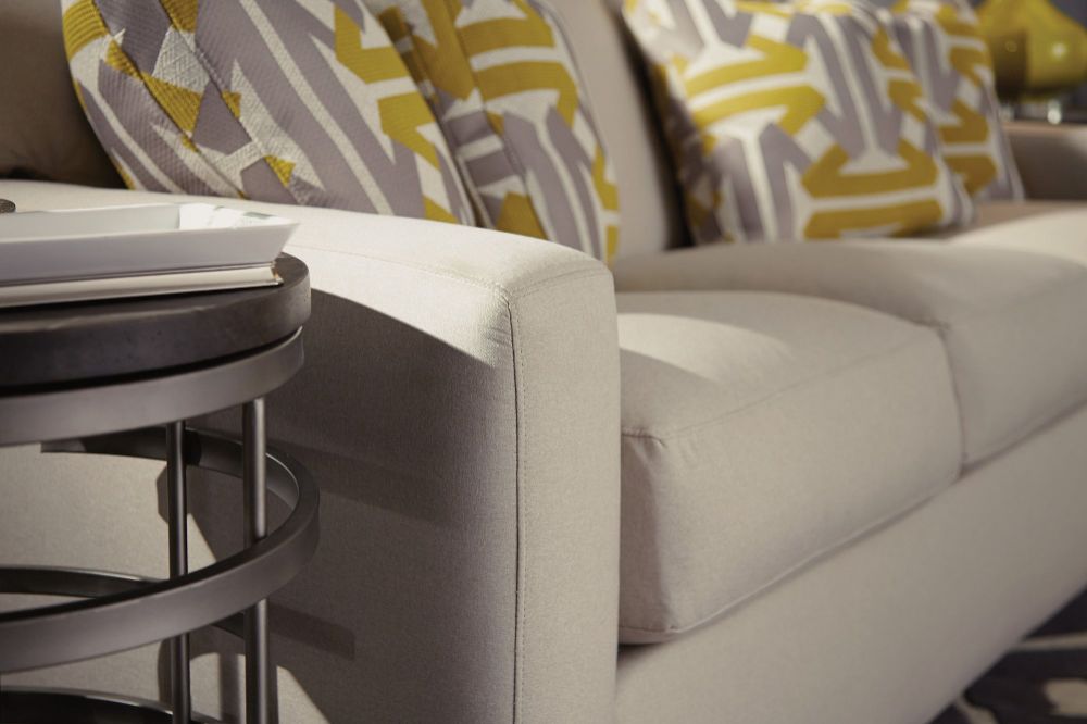 Highlighting the tailoring on the arm of Flexsteel Bryant sofa with accent pillows.