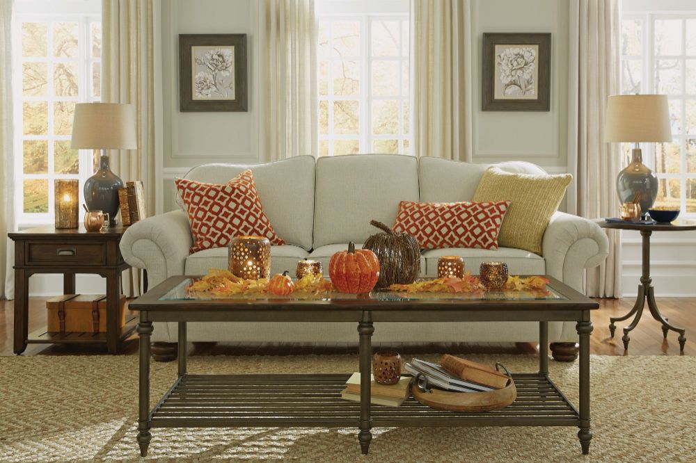 Flexsteel Bexley Sofa without Nail head shown behind glass top coffee table.