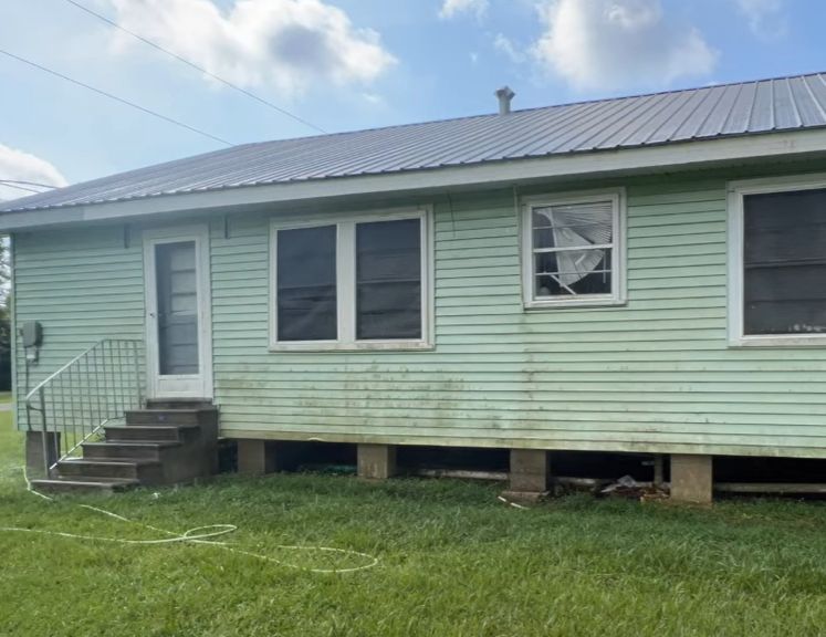 This old property will benefit from a power washing of the siding to remove moss growth.